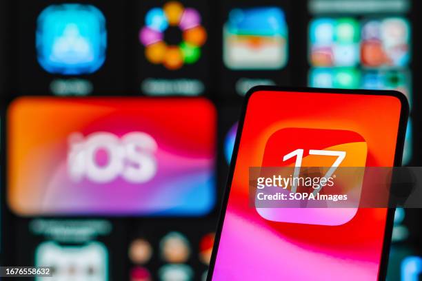 In this photo illustration, the iOS 17 logo is displayed on a smartphone screen.