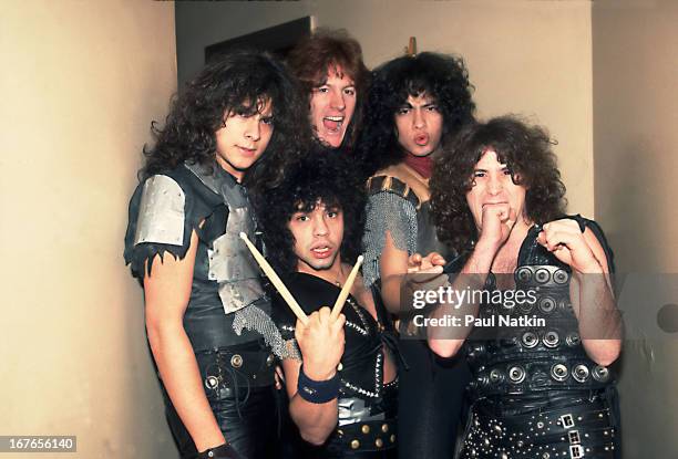 Portrait of American heavy metal band Armored Saint as they poses backstage, Chicago, Illinois, February 9, 1985. Pictured are, from left, Phil...