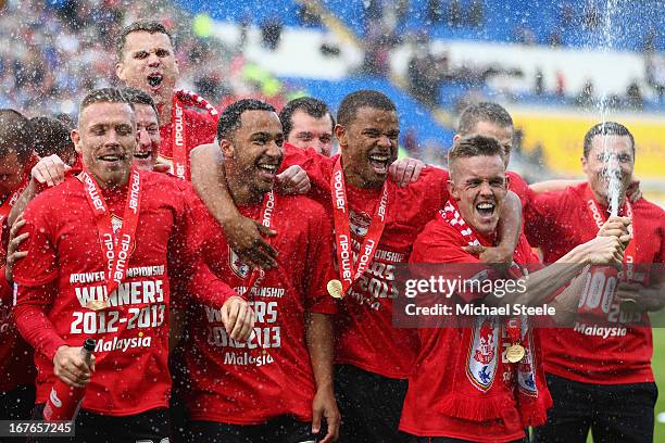 Craig Noone of Cardiff City sprays champagne alongside Fraizer Campbell ,Nicky Maynard and Craig Bellamy during championship victory celebrations...