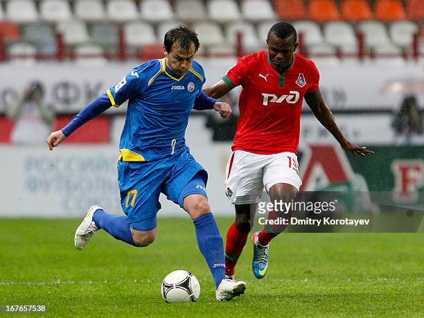 Victor Obinna of FC Lokomotiv Moscow is challenged by Danko Lazovic of FC Rostov Rostov-on-Don during the Russian Premier League match between FC...