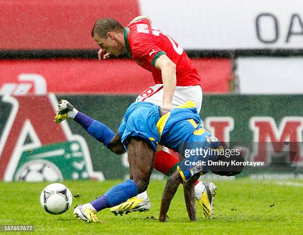 Jan Durica of FC Lokomotiv Moscow is challenged by Guelor Kanga of FC Rostov Rostov-on-Don during the Russian Premier League match between FC...