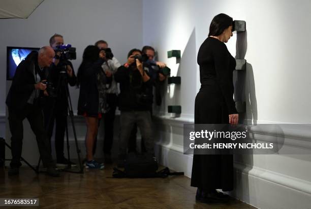 Serbian performance artist Marina Abramovic poses with one of her artworks, entitled 'Black Dragons' during a photocall at the Royal Academy of Arts...