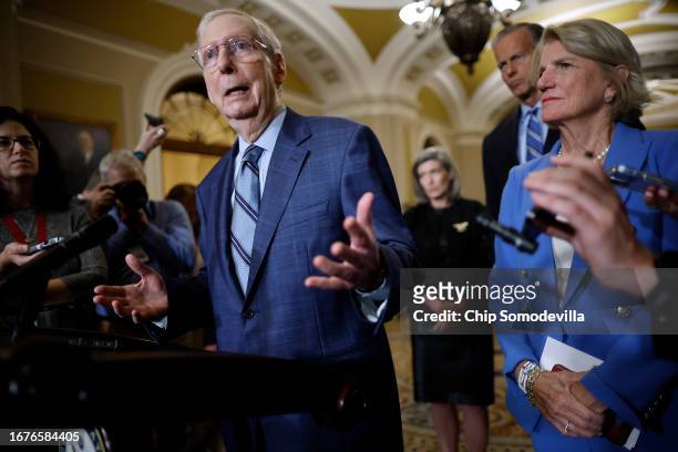 Senate Minority Leader Mitch McConnell talks to reporters with Sen. John Thune and Sen. Shelley Moore Capito following the weekly Republican Senate...