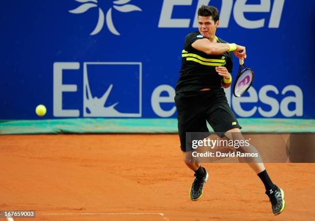 Milos Raonic of Canada returns the ball to Rafael Nadal of Spain during his semi-final match of day six of the 2013 Barcelona Open Banc Sabadell on...