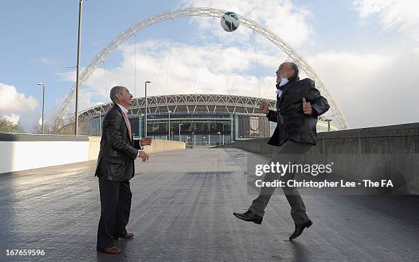 Ossie Ardilies and Ricky Villa show of their skills as they deliver the FA Cup Final match ball to Wembley Stadium, during the Wembley Pass on April...