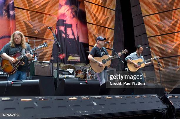 From left, American guitarist/vocalists Warren Haynes, Greg Allman, and Dave Matthews perform on stage at the 22nd Annual Farm Aid concert, Randall's...