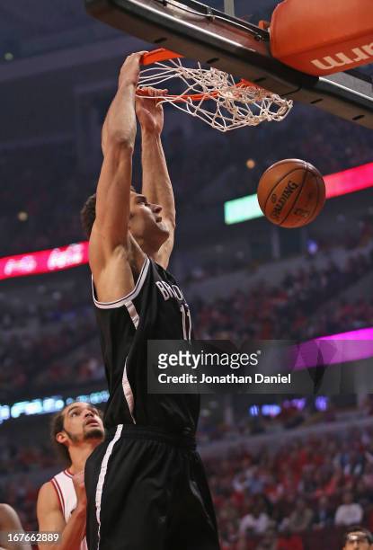 Brook Lopez of the Brooklyn Nets dunks over Joakim Noah of the Chicago Bulls in Game Five of the Eastern Conference Quarterfinals in the 2013 NBA...