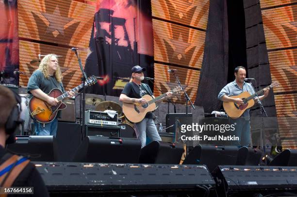 From left, American guitarist/vocalists Warren Haynes, Greg Allman, and Dave Matthews perform on stage at the 22nd Annual Farm Aid concert, Randall's...
