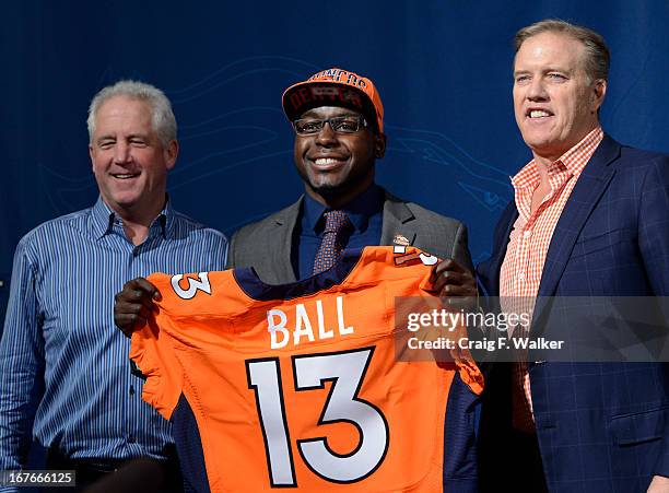 Denver Broncos Head Coach John Fox, left and Executive Vice President of Football Operations John Elway, right, introduce RB Montee Ball during a...