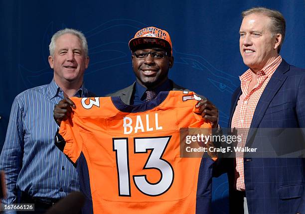 Denver Broncos Head Coach John Fox, left and Executive Vice President of Football Operations John Elway, right, introduce RB Montee Ball during a...