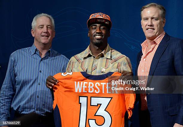 Denver Broncos Head Coach John Fox, left and Executive Vice President of Football Operations John Elway, right, introduce CB Kayvon Webster during a...