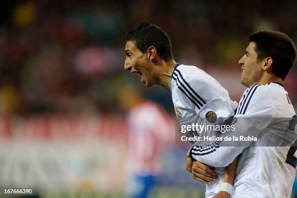 Angel de Di Maria and Alvaro Morata of Real Madrid celebrate after scoring during the La Liga match between Atletico de Madrid and Real Madrid at...