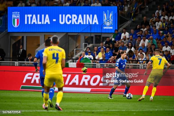 Nicolò Barella of Italy in action against Andriy Yarmolenko of Ukraine during the UEFA EURO 2024 European qualifier match between Italy and Ukraine...