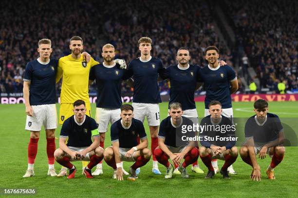 Players of Scotland pose for a team photograph prior to the 150th Anniversary Heritage Match between Scotland and England at Hampden Park on...