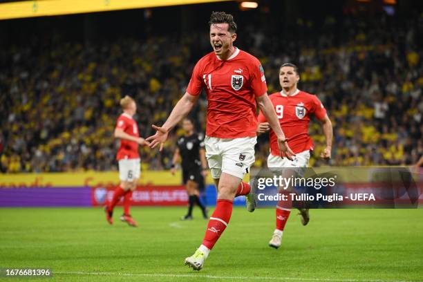 Michael Gregoritsch of Austria celebrates after scoring the team's second goal during the UEFA EURO 2024 European qualifier match between Sweden and...