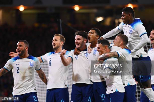 Jude Bellingham of England celebrates with teammates after scoring the team's second goal during the 150th Anniversary Heritage Match between...