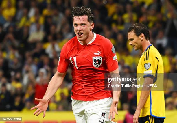 Michael Gregoritsch of Austria celebrates after scoring the team's first goal during the UEFA EURO 2024 European qualifier match between Sweden and...