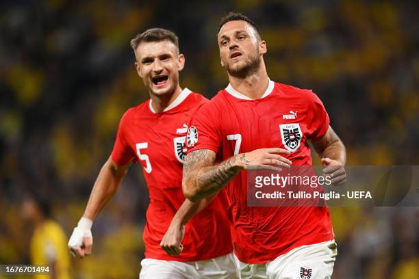 Marko Arnautovic of Austria celebrates after scoring the team's third goal during the UEFA EURO 2024 European qualifier match between Sweden and...