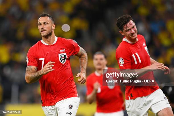 Marko Arnautovic of Austria celebrates after scoring the team's third goal during the UEFA EURO 2024 European qualifier match between Sweden and...