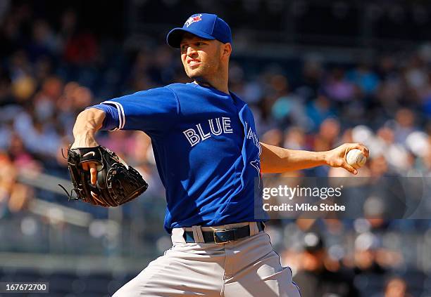Happ of the Toronto Blue Jays pitches in the first-inning against the New York Yankees at Yankee Stadium on April 27, 2013 in the Bronx borough of...