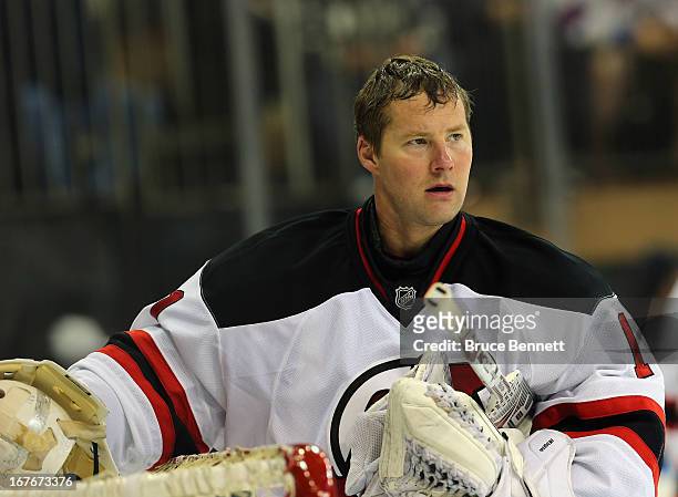Johan Hedberg of the New Jersey Devils waits for play to begin against the New York Rangers at Madison Square Garden on April 27, 2013 in New York...