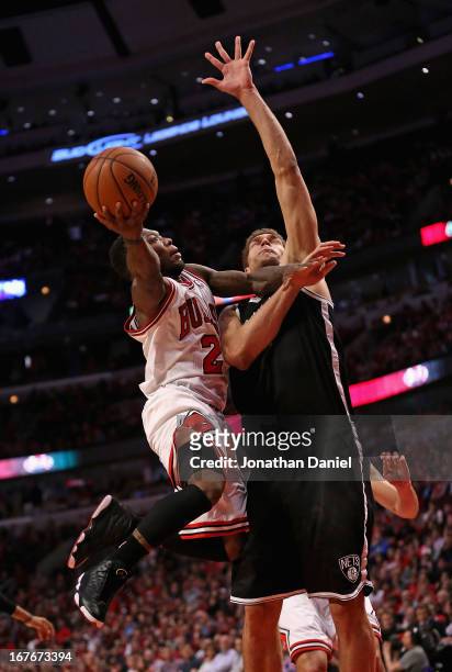 Nate Robinson of the Chicago Bulls drives to the basket against Brook Lopez of the Brooklyn Nets in Game Five of the Eastern Conference Quarterfinals...