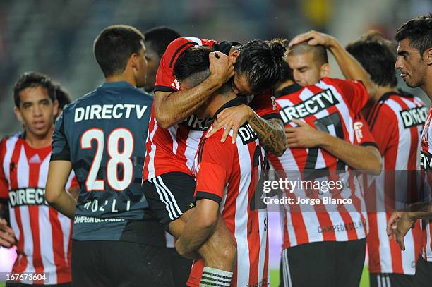 Players of Estudiantes de La Plata celebrate at the end of a match between Estudiantes de La Plata and Boca Juniors as part of the Torneo Final 2013...