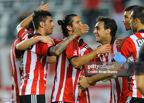 Players of Estudiantes de La Plata celebrate at the end of a match between Estudiantes de La Plata and Boca Juniors as part of the Torneo Final 2013...