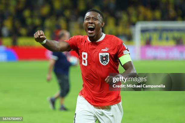 David Alaba of Austria celebrates following the team's victory during the UEFA EURO 2024 European qualifier match between Sweden and Austria at...