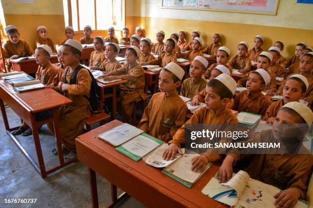 Afghan orphan boys attend a class at the Sheikh Zayed orphanage in Kandahar on September 19, 2023.