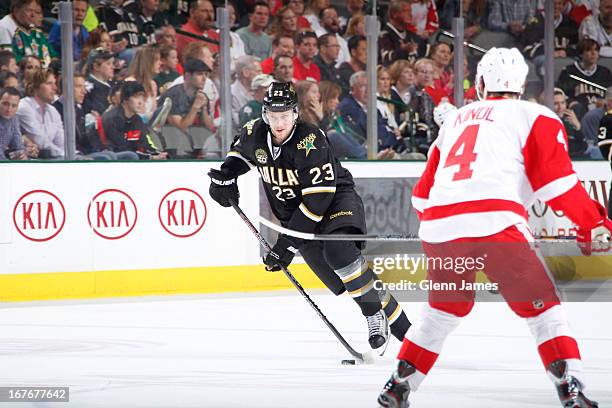 Tom Wandell of the Dallas Stars handles the puck against Jakub Kindl of the Detroit Red Wings at the American Airlines Center on April 27, 2013 in...