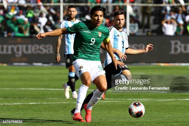 Marcelo Moreno of Bolivia competes for the ball with Nicolas Tagliafico of Argentina during a FIFA World Cup 2026 Qualifier match between Bolivia and...