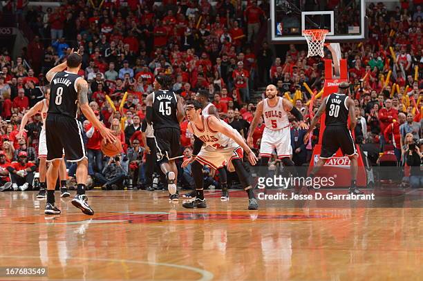 Deron Williams of the Brooklyn Nets dribbles the ball and calls a play against the Chicago Bulls in Game Four of the Eastern Conference Quarterfinals...