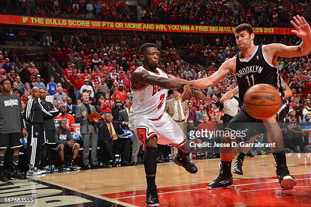 Nate Robinson of the Chicago Bulls passes the ball baseline against the Brooklyn Nets in Game Four of the Eastern Conference Quarterfinals during the...