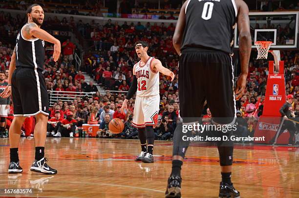 Kirk Hinrich of the Chicago Bulls calls a play against the Brooklyn Nets in Game Four of the Eastern Conference Quarterfinals during the 2013 NBA...