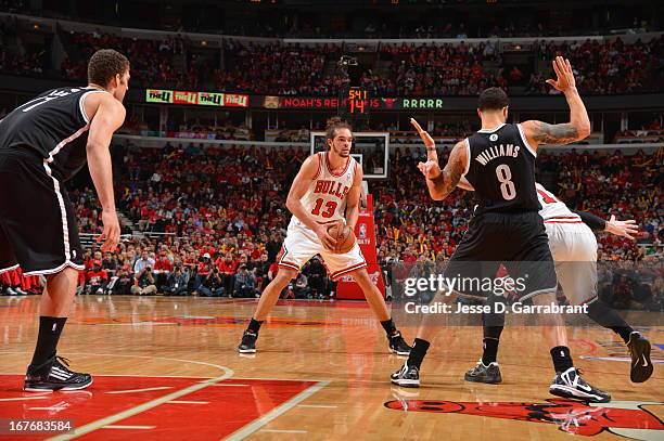 Joakim Noah of the Chicago Bulls looks to pass the ball against the Brooklyn Nets in Game Four of the Eastern Conference Quarterfinals during the...