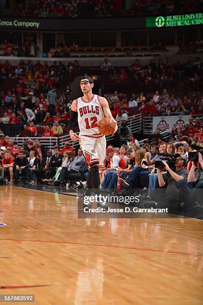 Kirk Hinrich of the Chicago Bulls pushes the ball up the court against the Brooklyn Nets in Game Four of the Eastern Conference Quarterfinals during...