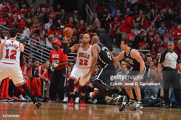 Taj Gibson of the Chicago Bulls passes the ball against the Brooklyn Nets in Game Four of the Eastern Conference Quarterfinals during the 2013 NBA...