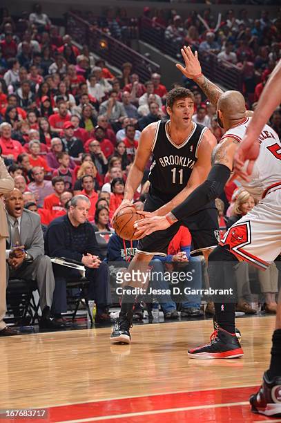 Brook Lopez of the Brooklyn Nets looks to pass the ball downlow against the Chicago Bulls in Game Four of the Eastern Conference Quarterfinals during...