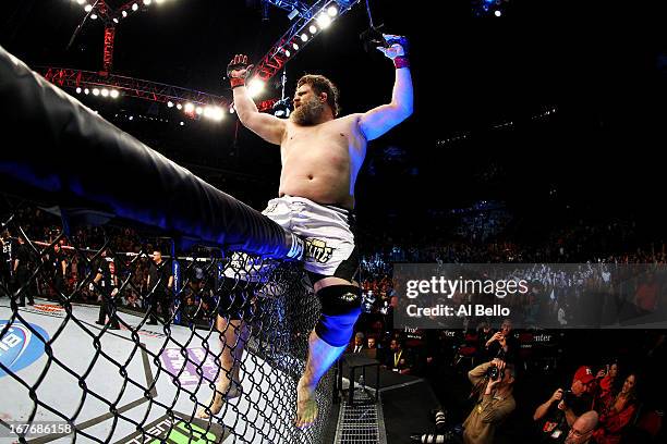 Roy Nelson celebrates his win by knockout against Cheick Kongo of France in their heavyweight bout during the UFC 159 event at the Prudential Center...