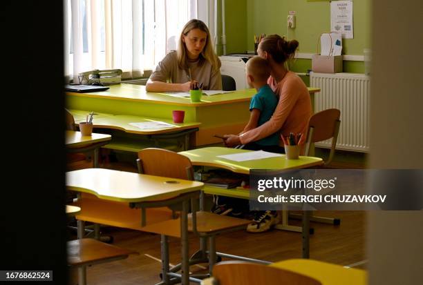 Boy receives a medical examination by doctors of a medical brigade from Kyiv's Okhmadyt Children's Hospital in the primary school of Myrne village,...