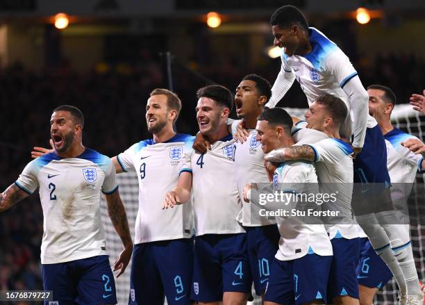 Jude Bellingham of England celebrates with team mates after scoring the team's aecond goal during the 150th Anniversary Heritage Match between...