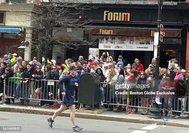 This cell phone image, taken in front of the Forum Restaurant, appears to show Boston Marathon bombing suspect, Dzhokhar A. Tsarnaev, near a young...