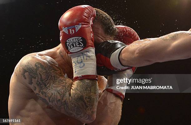 World Boxing Council middleweight defending champion Sergio "Maravilla" Martinez of Argentina punch on the face of challenger Martin Murray of...