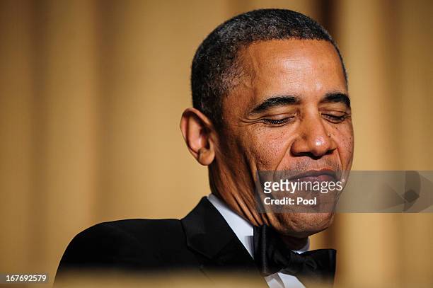 President Barack Obama reacts to a joke told by comedian Conan O'Brien during the White House Correspondents' Association Dinner on April 27, 2013 in...