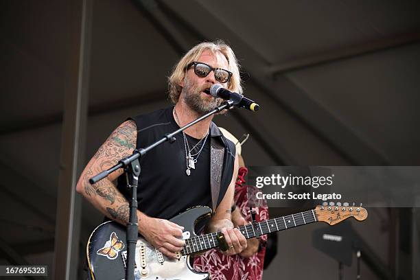 Anders Osborne of Voice of the Wetlands All-Stars performs during the 2013 New Orleans Jazz & Heritage Music Festival at Fair Grounds Race Course on...