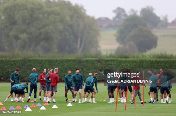 Arsenal players attend a team training session at Arsenal's training ground in north London on September 19 ahead of their UEFA Champions League...