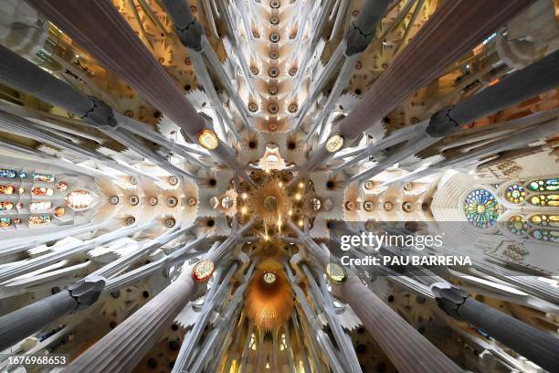 This picture taken on September 19, 2023 shows a view of the ceiling of the Expiatory Church of the Sagrada Familia basilica during a press...