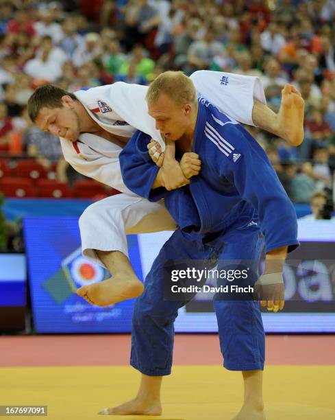Lukas Krpalek of the Czeck Republic attempts a leaping armlock against former World champion Henk Grol of Holland ahead of winning the u100kgs gold...