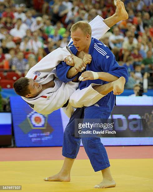 Lukas Krpalek of the Czeck Republic attempts a leaping armlock against former World champion Henk Grol of Holland on his way to winning the u100kgs...